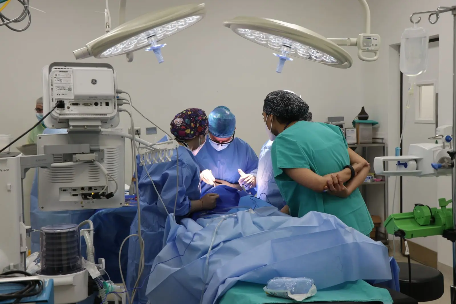 Anesthesia and surgical team at work in a modern operating room