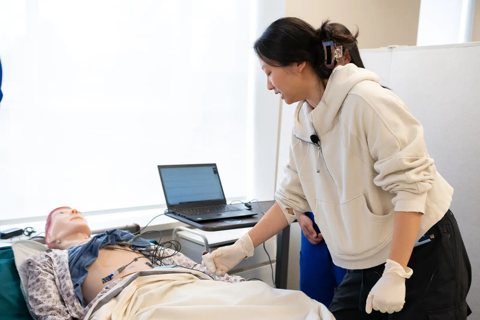 Clinician practicing on a simulation mannequin